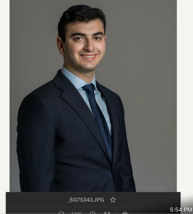 Benjamin Yazdi wearing a suit and tie